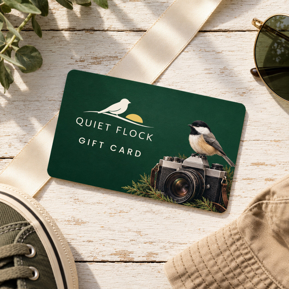 Quiet Flock gift card with a chickadee on a vintage camera